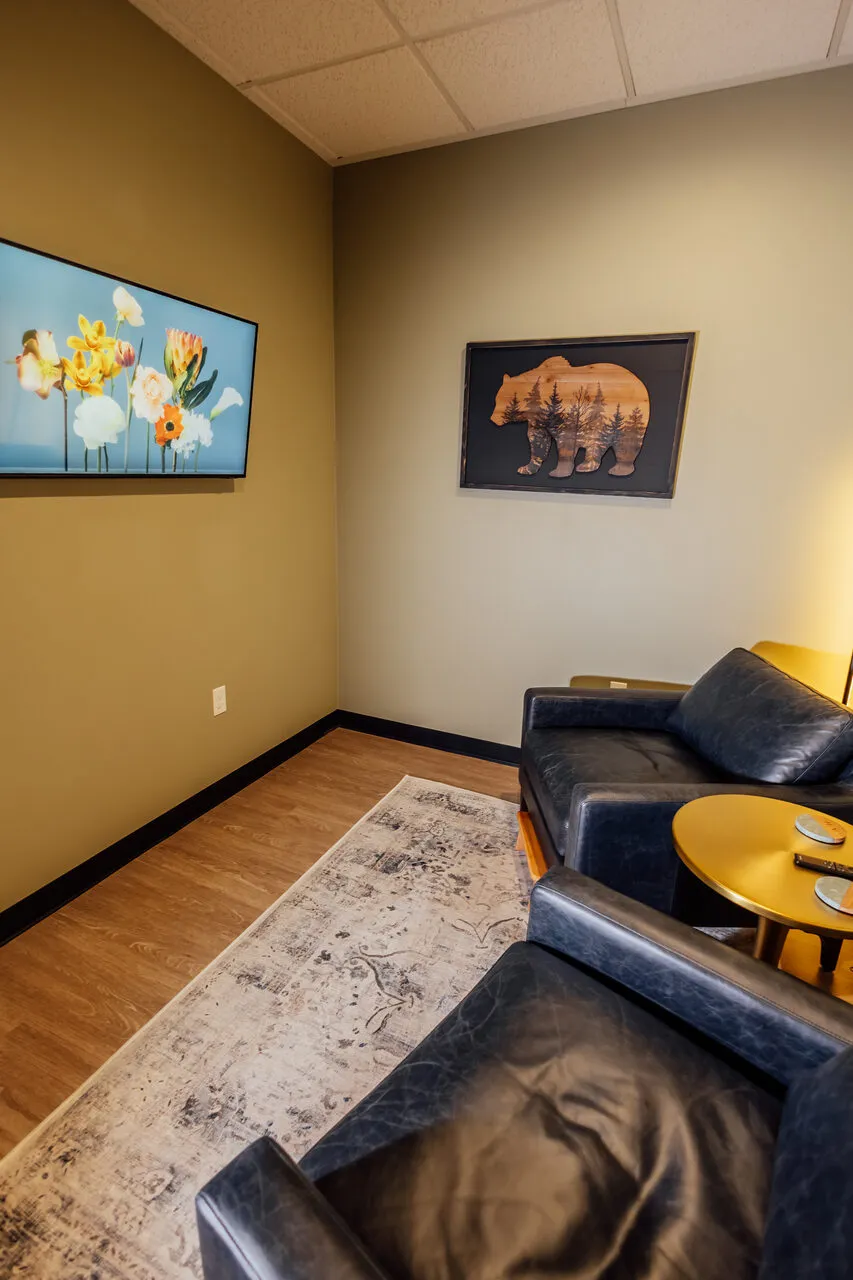 Private consultation room at Asymmetric Health with calm, residential-style decor