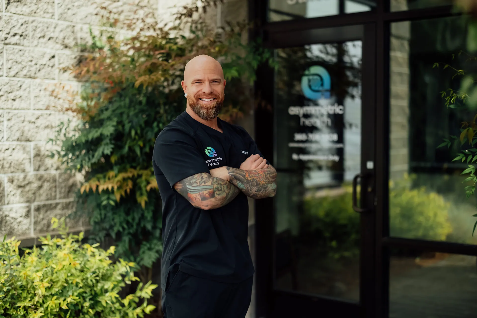 Dr. Ian Strand, DO outside the Asymmetric Health clinic in Lacey, WA