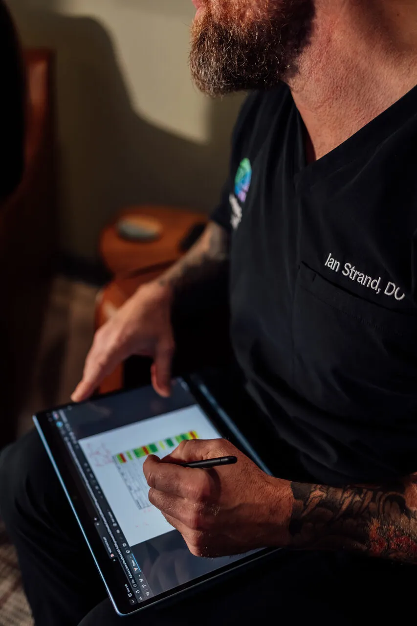 Provider reviewing weight loss lab results with a patient over a tablet telehealth visit